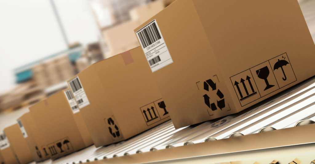 Several shipping boxes are lined up in a row with international labels.